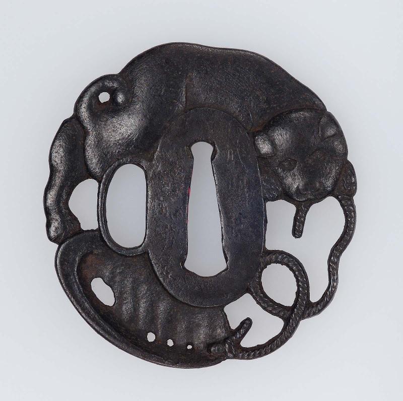 Tsuba with design of puppy playing with a shell