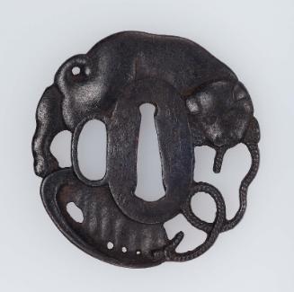Tsuba with design of puppy playing with a shell