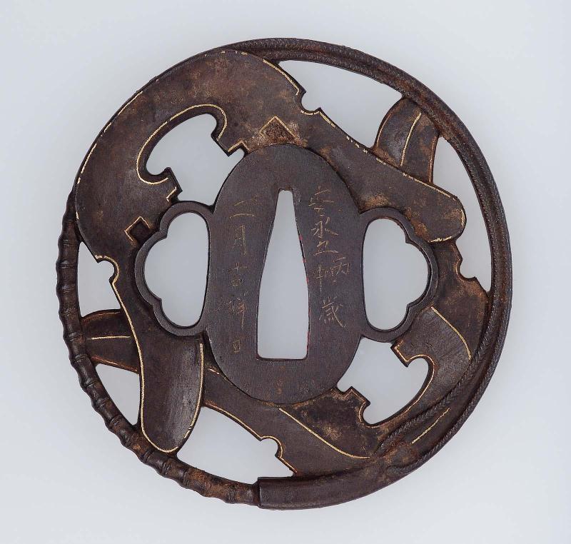 Tsuba with design of saddles and tassels
