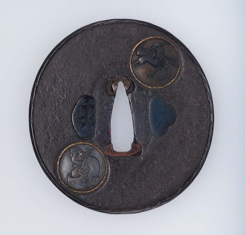 Tsuba with design of crow on the sun  and hare pounding rice on the moon