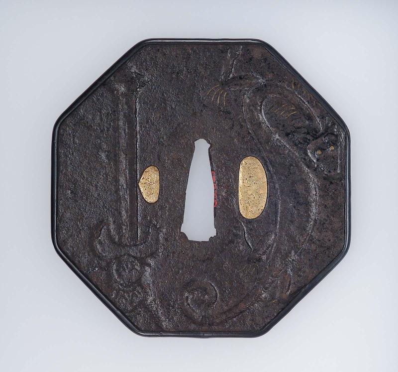 Tsuba with design of dragons and swords