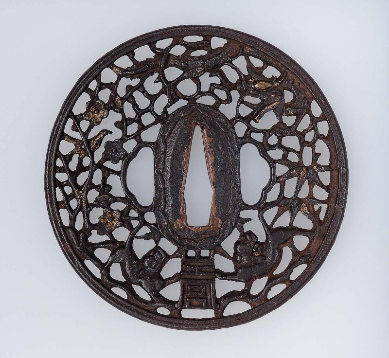 Tsuba with design of fabulous beasts and cherry blossom