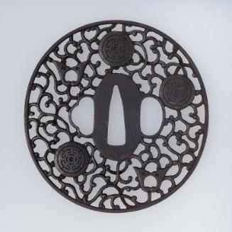 Tsuba with design of daki-myoga, roundels and arabesques