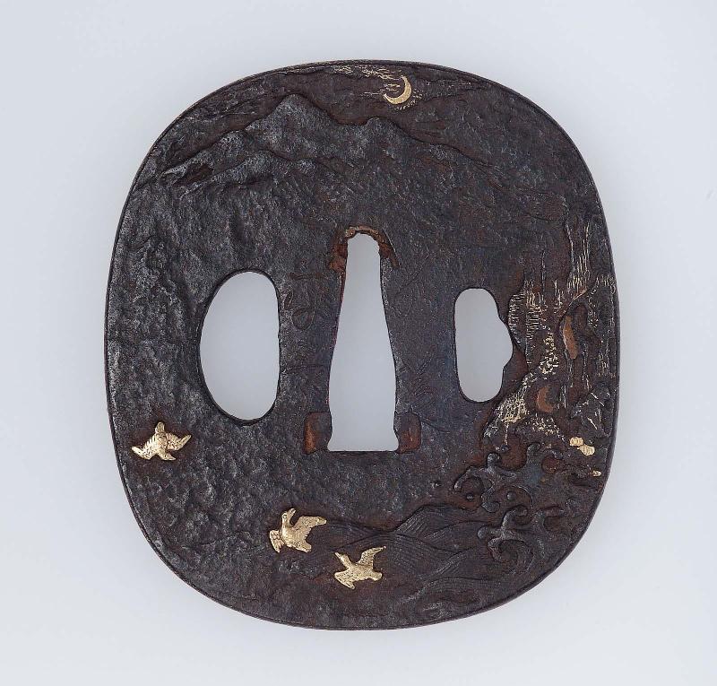 Tsuba with design of birds, waves, crags, mountains and moon