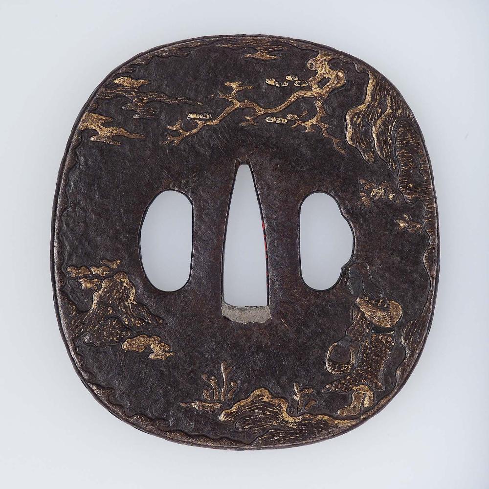 Tsuba with design of landscape with woman gathering ferns