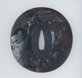 Tsuba with design of shishi on a rock