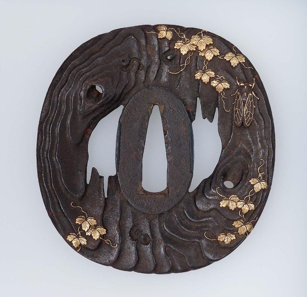 Tsuba with design of tree-bark and creeper, with a fly