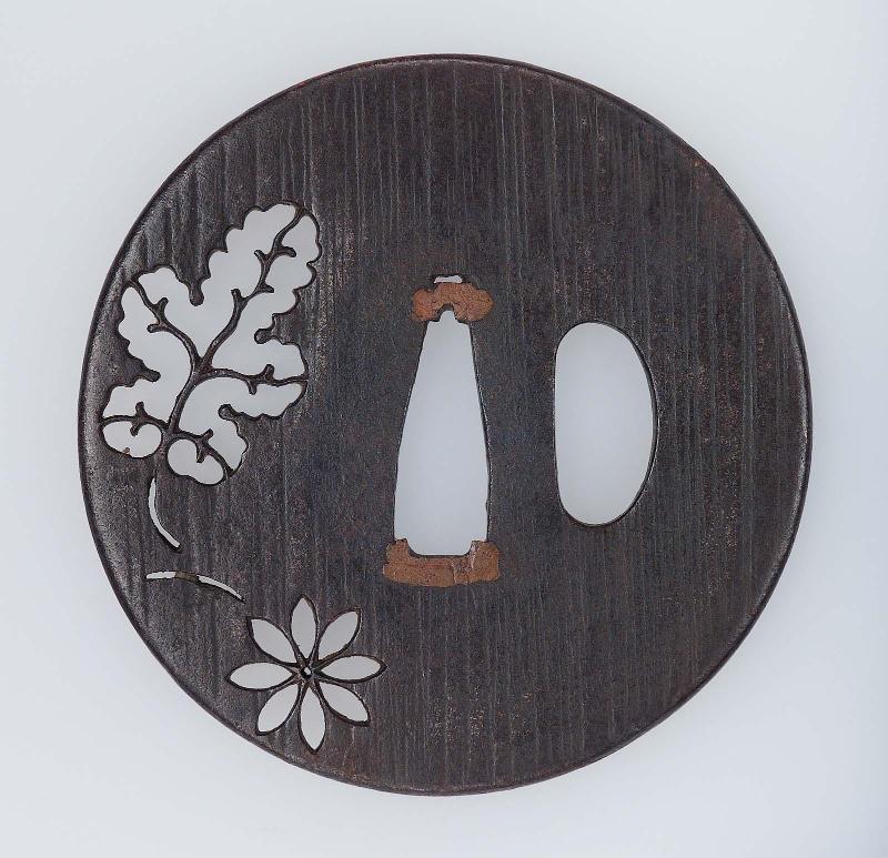 Tsuba with design of cherry-blossom and leaf