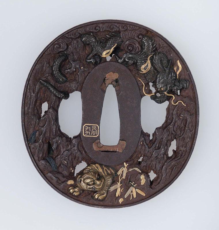 Tsuba with design of dragon, tiger, bamboo and tree