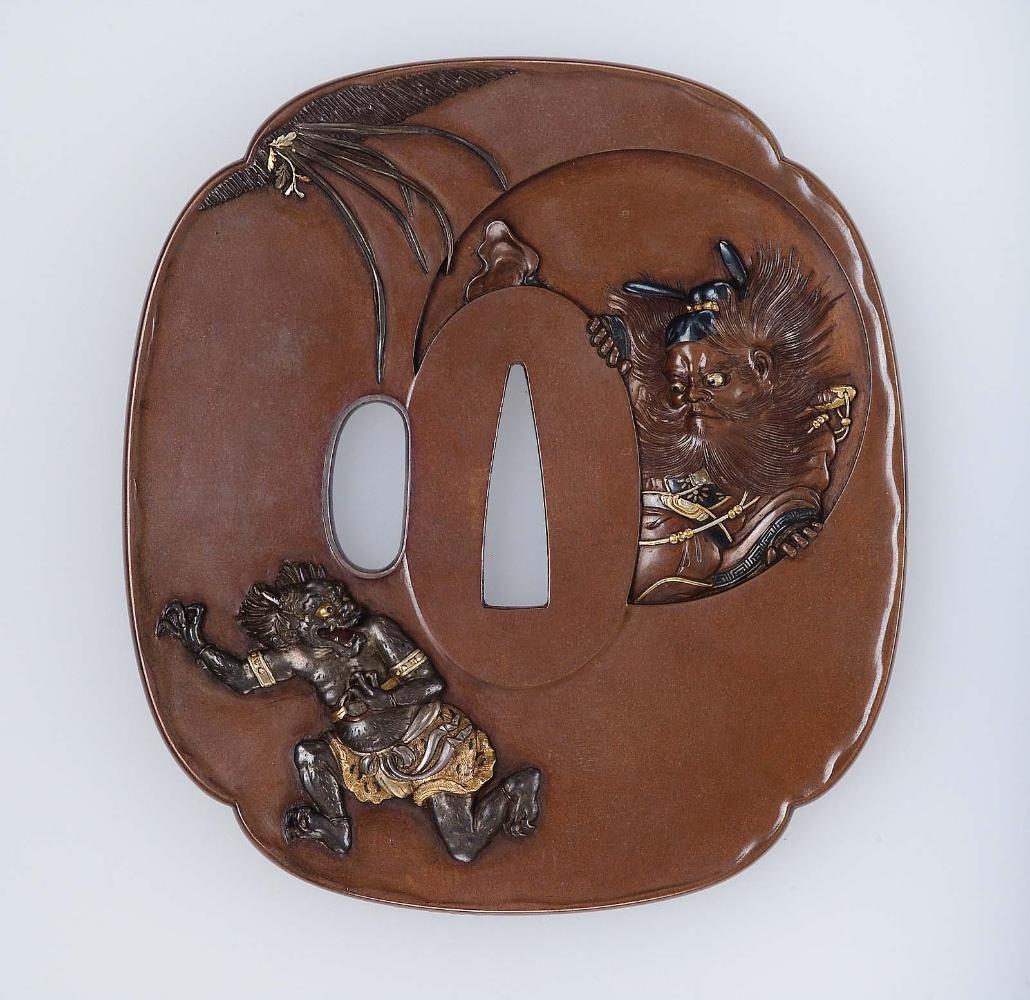 Tsuba with design of an oni fleeing from Shoki