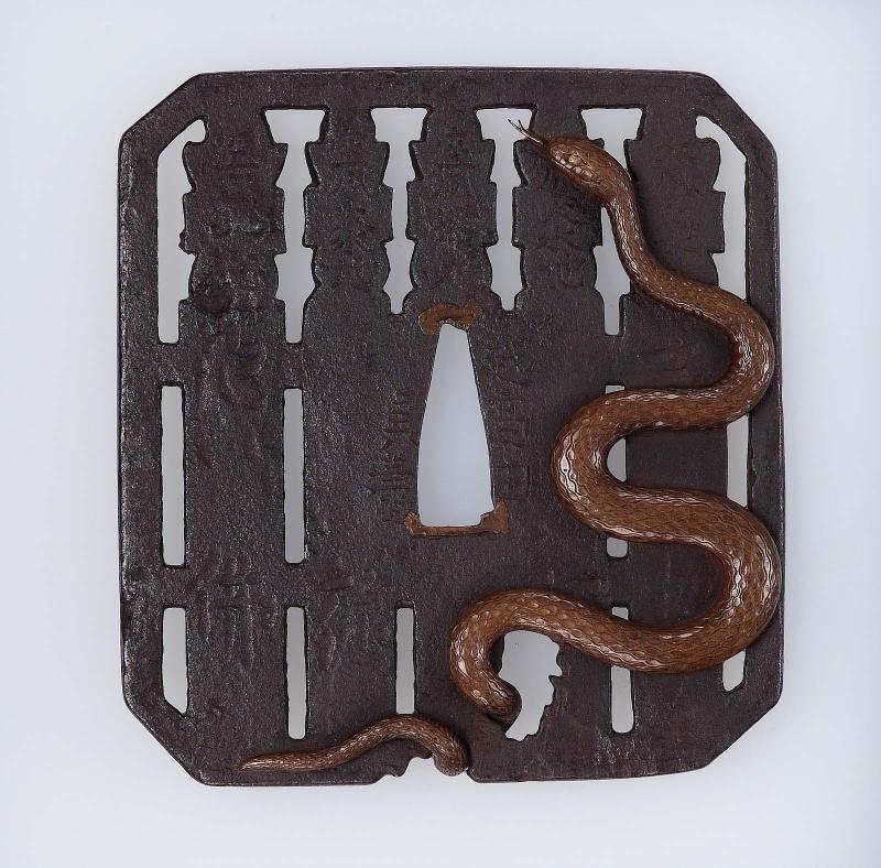 Tsuba with design of grave-posts and snake