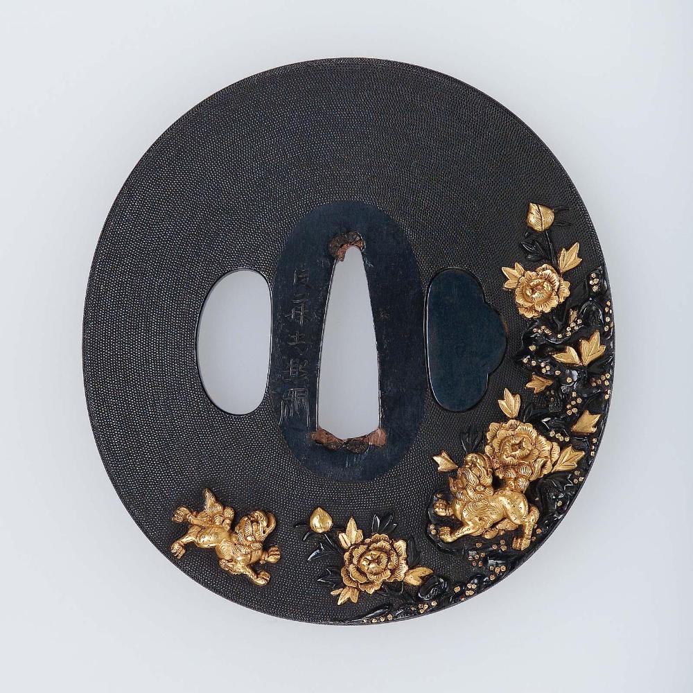 Tsuba with design of shishi and peonies