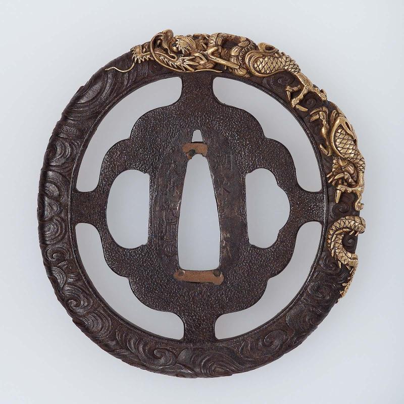 Tsuba with design of dragon and waves on the rim