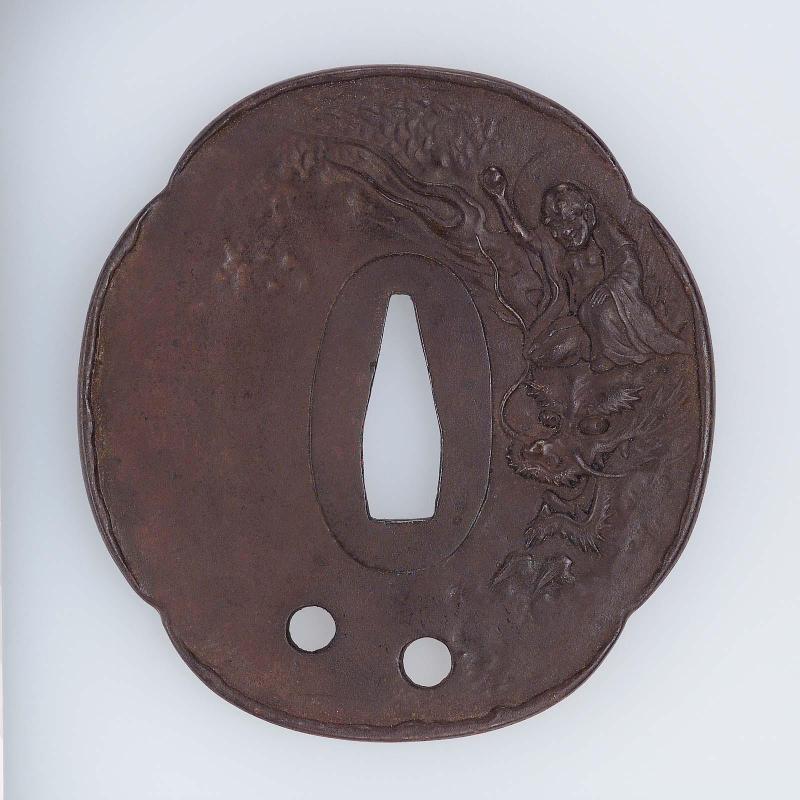Tsuba with design of rakan riding a dragon