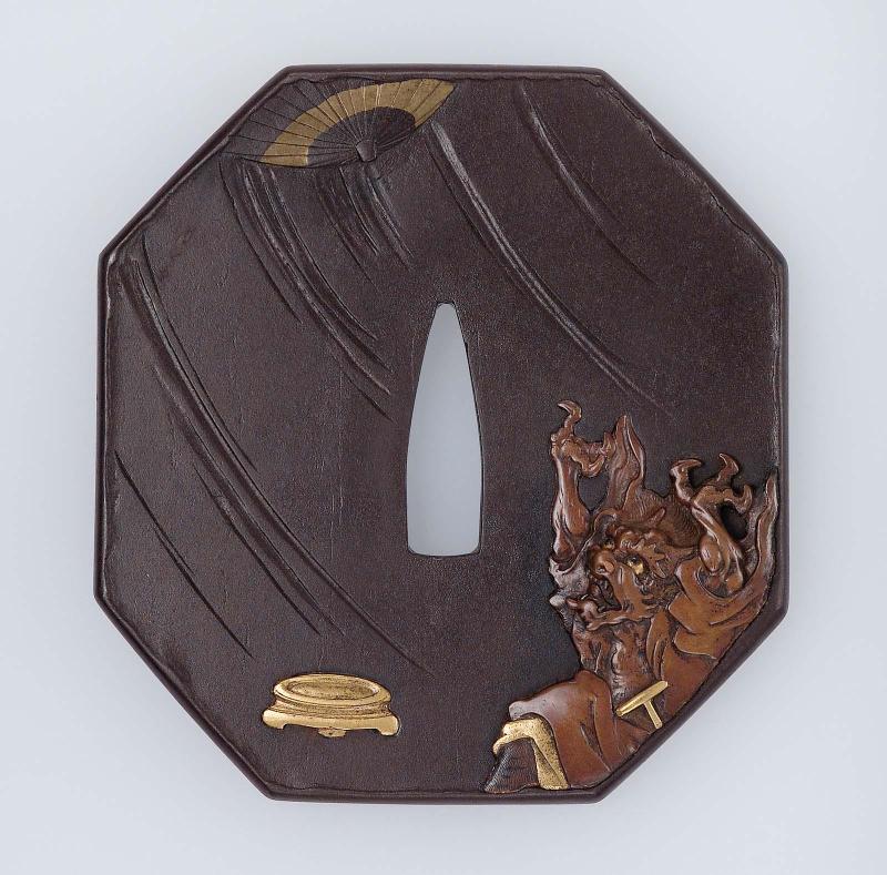 Tsuba with design of an oni and his umbrella flying away