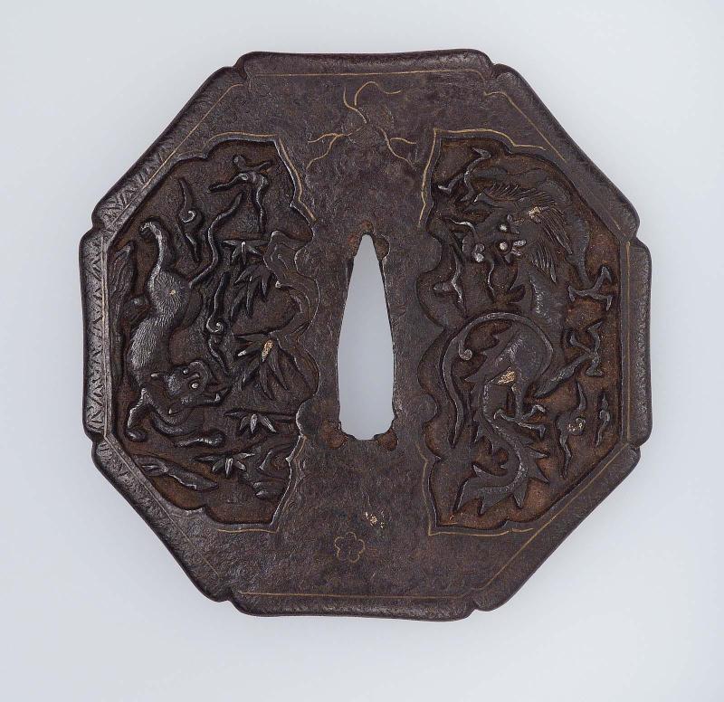 Tsuba with design of tiger, dragon, bamboo and clouds