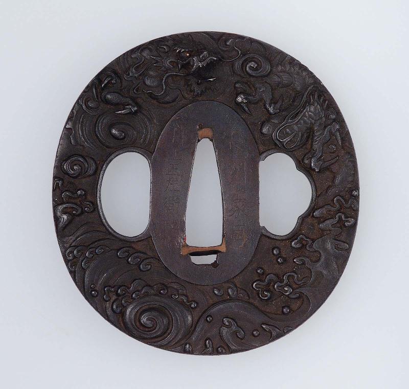Tsuba with design of dragon, cloud and waves