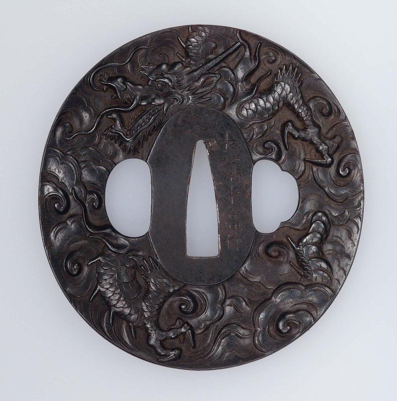 Tsuba with design of dragon and clouds