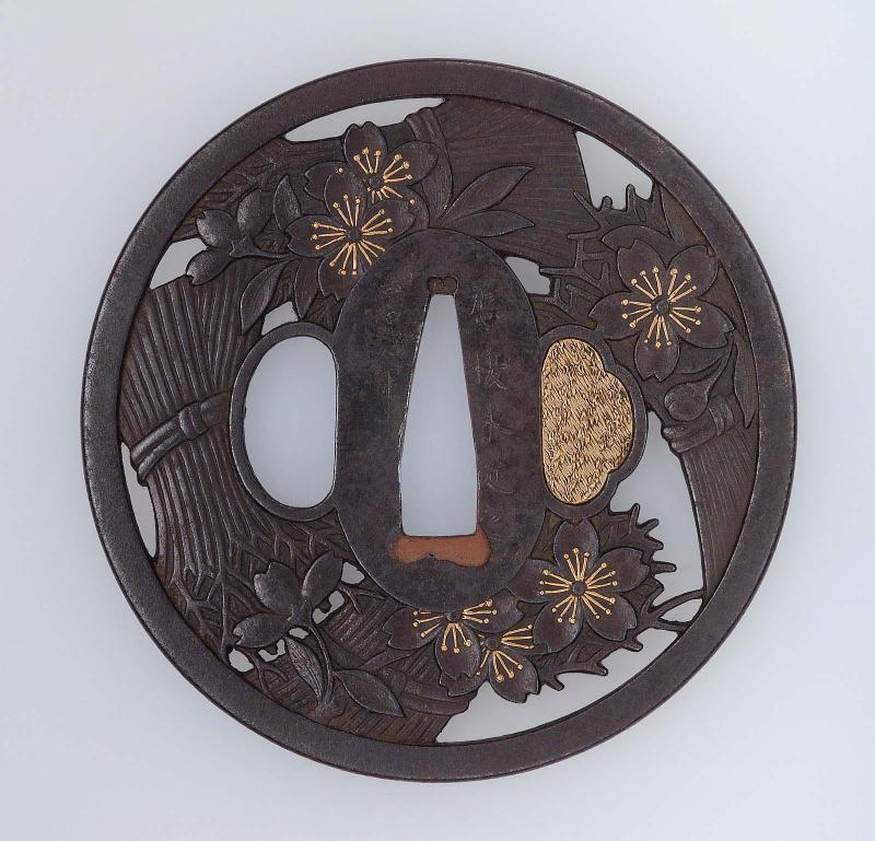 Tsuba with design of cherry blossoms and bundles of faggots
