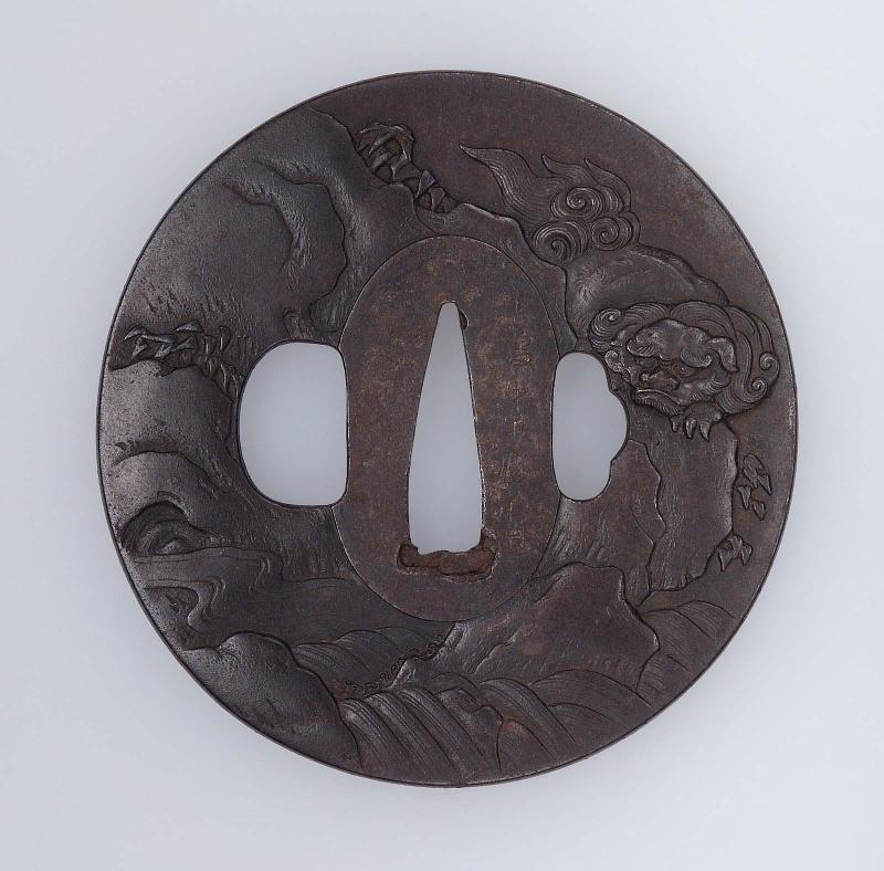 Tsuba with design of shishi and waterfall