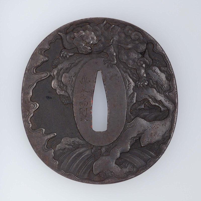 Tsuba with design of shishi, crag and waterfall