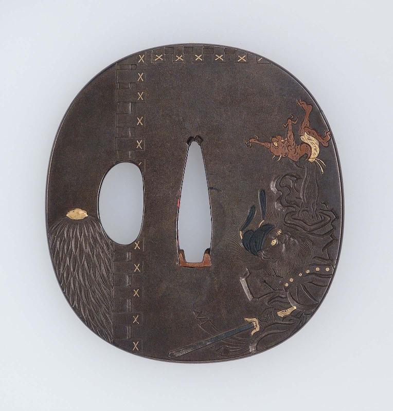 Tsuba with design of Shoki holding an oni aloft