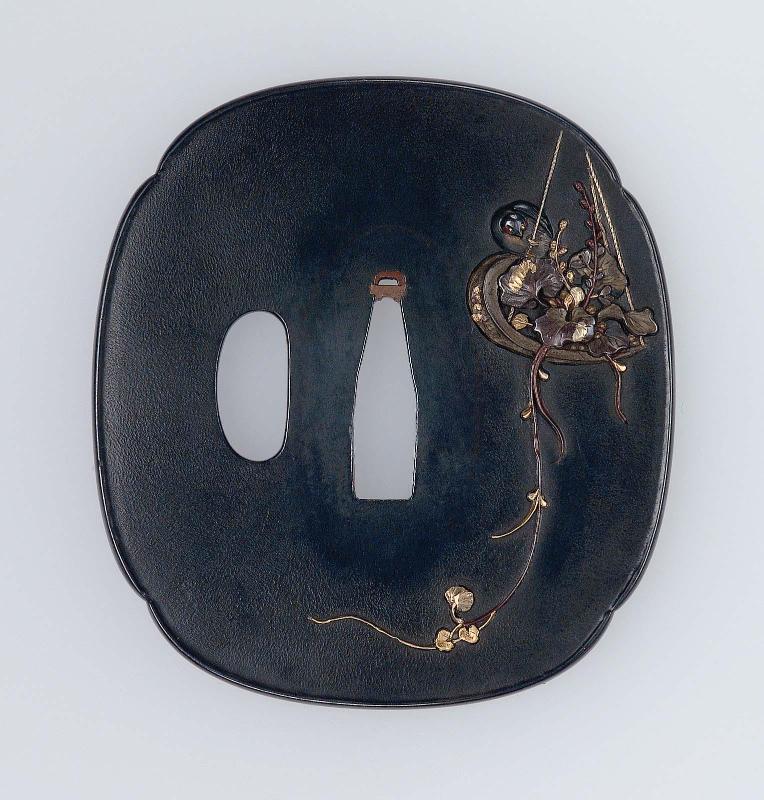 Tsuba with design of swallows and hanging flower arrangement