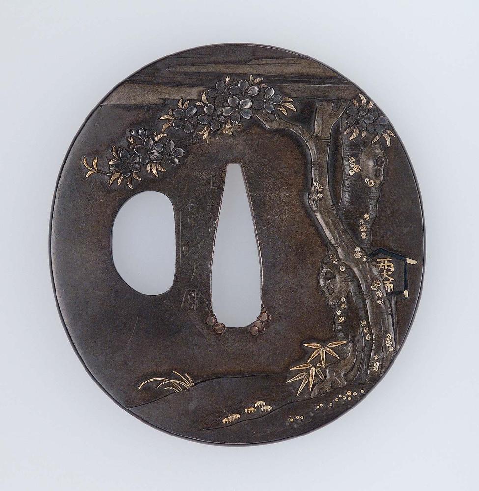 Tsuba with design of cherry tree and basket of clams