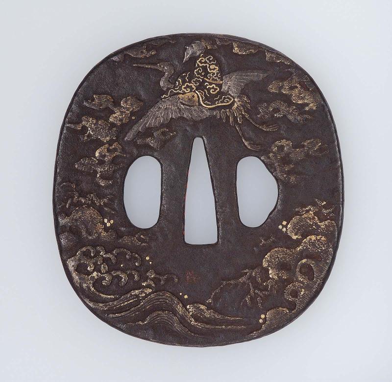 Tsuba with design of Jurojin riding on a crane