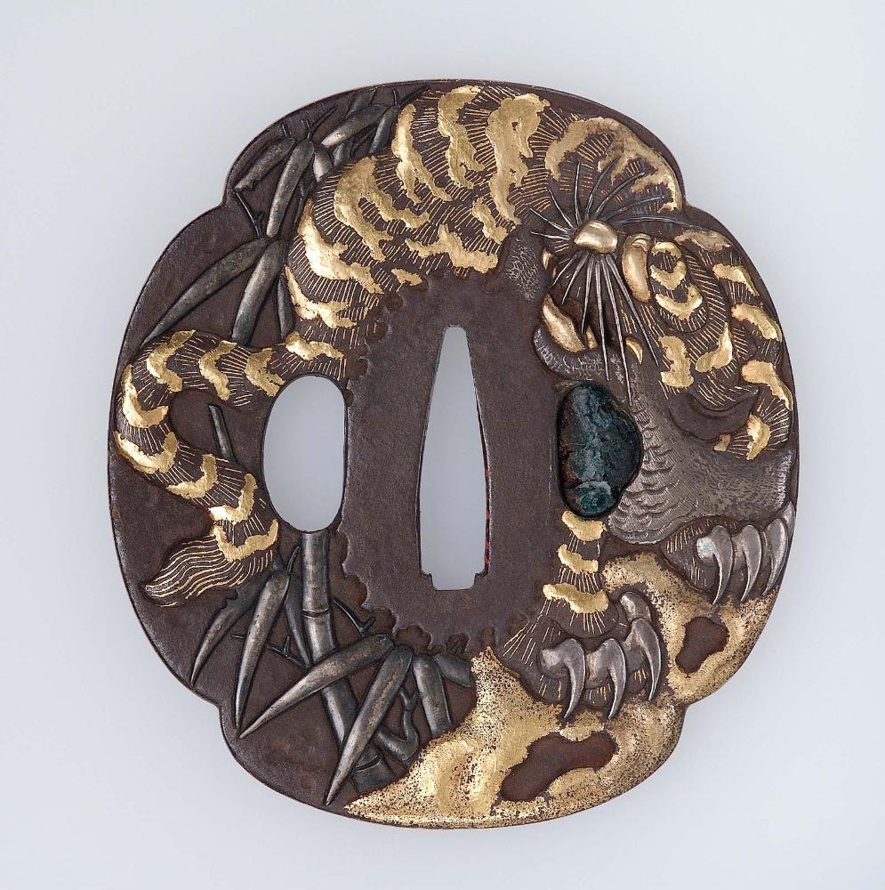 Tsuba with design of tiger, dragon and bamboo