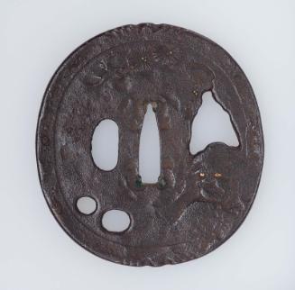 Tsuba with design of Daruma under a pine tree