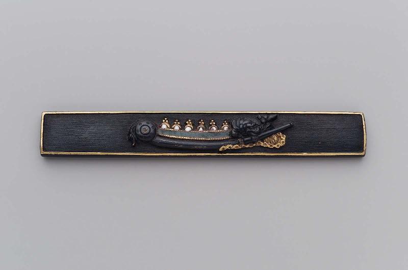 Kozuka with design of a tachi mounted in archaic style