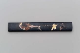 Kozuka with design of Hotei and two Chinese boys pulling his sack