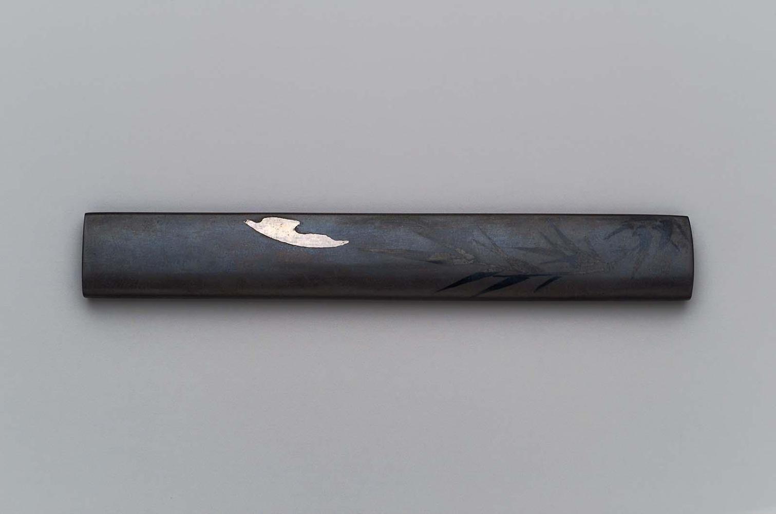 Kozuka with design of moon behind clouds, and bamboo