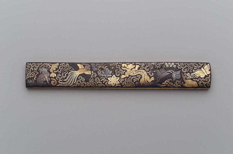 Kozuka with design of dragon. ho-o, fish, butterfly and shishi, with plant decoration