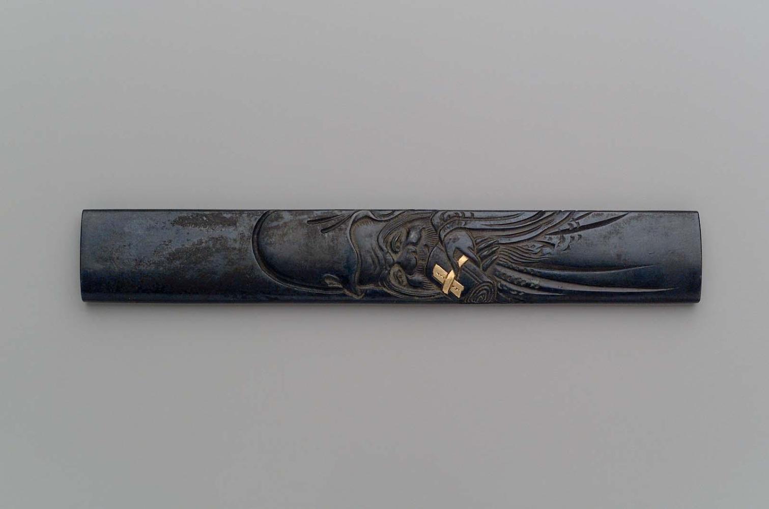 Kozuka with design of Jurojin holding a scroll