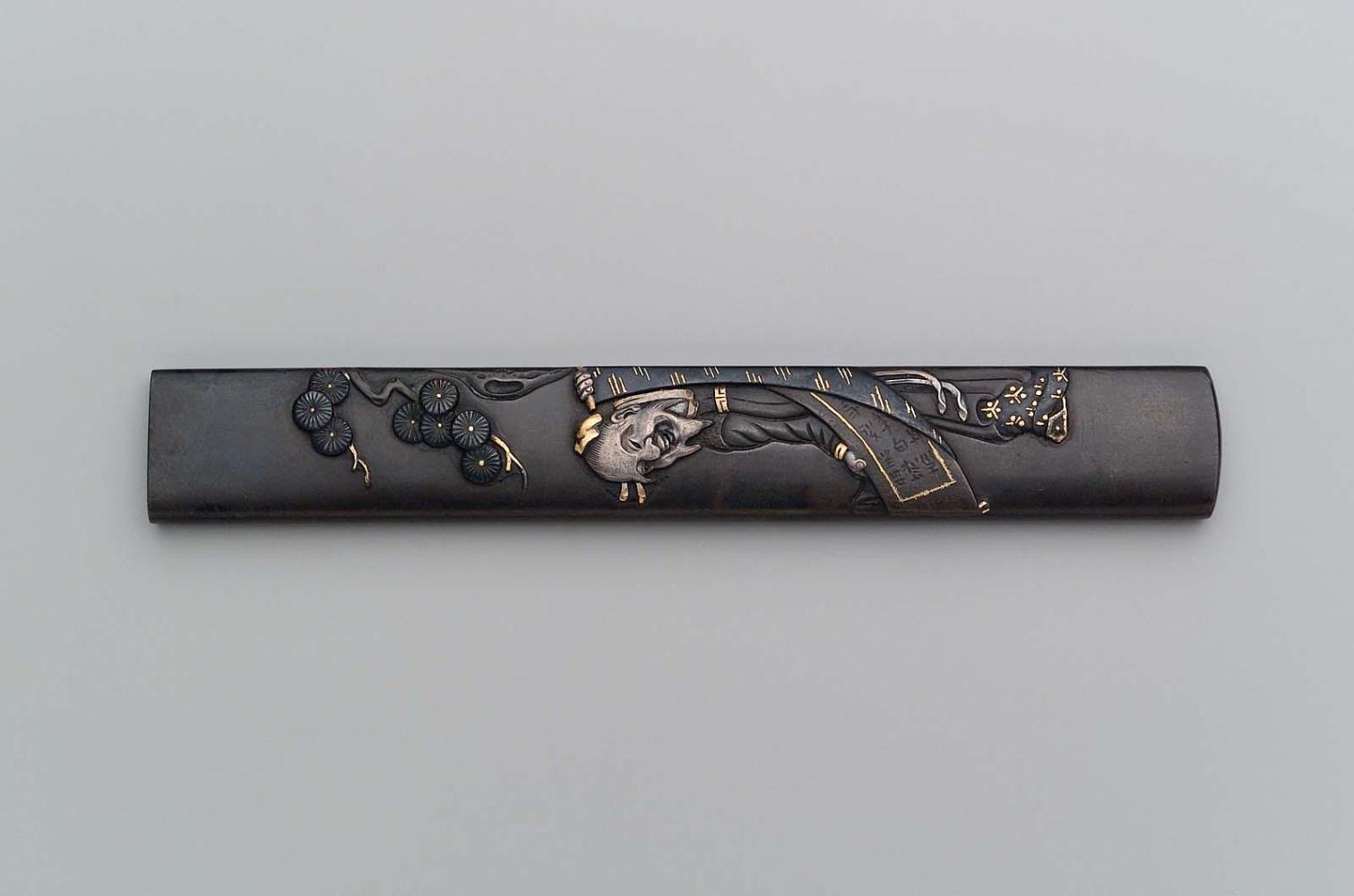 Kozuka with design of Chinese poet Rihaku (Li Bai) holding a scroll