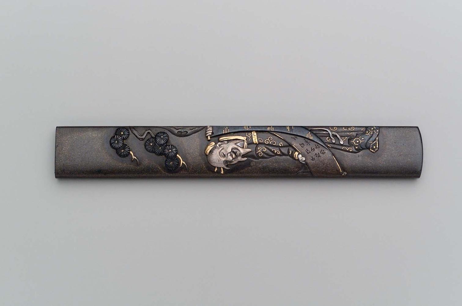 Kozuka with design of Li Bai holding a scroll