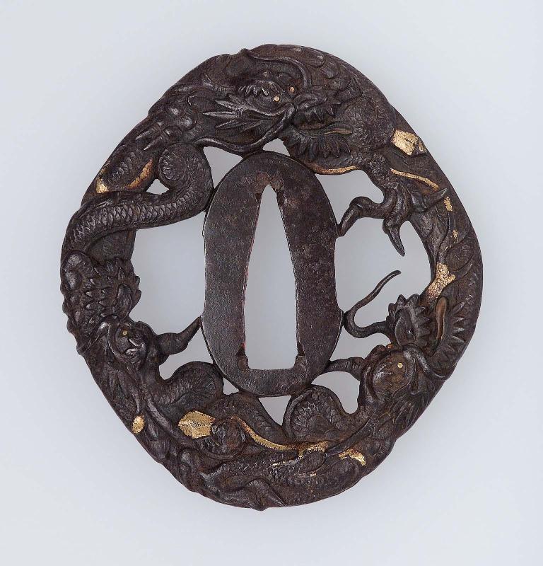Tsuba with design of dragons with jewels and swords