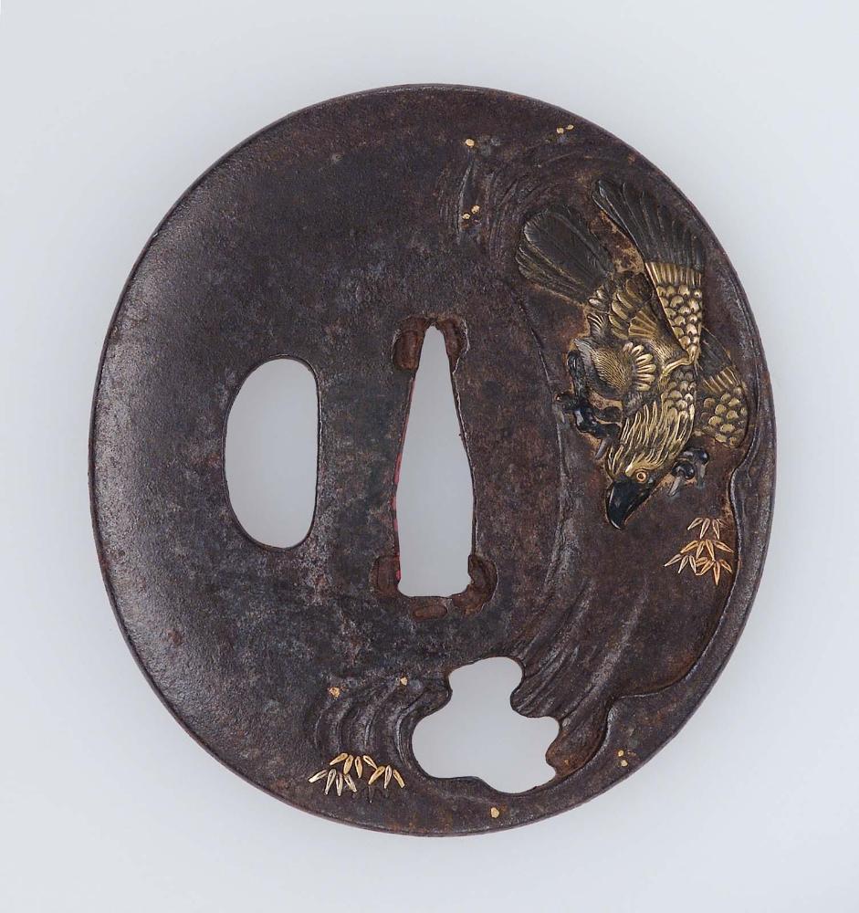 Tsuba with design of a monkey hiding from an eagle