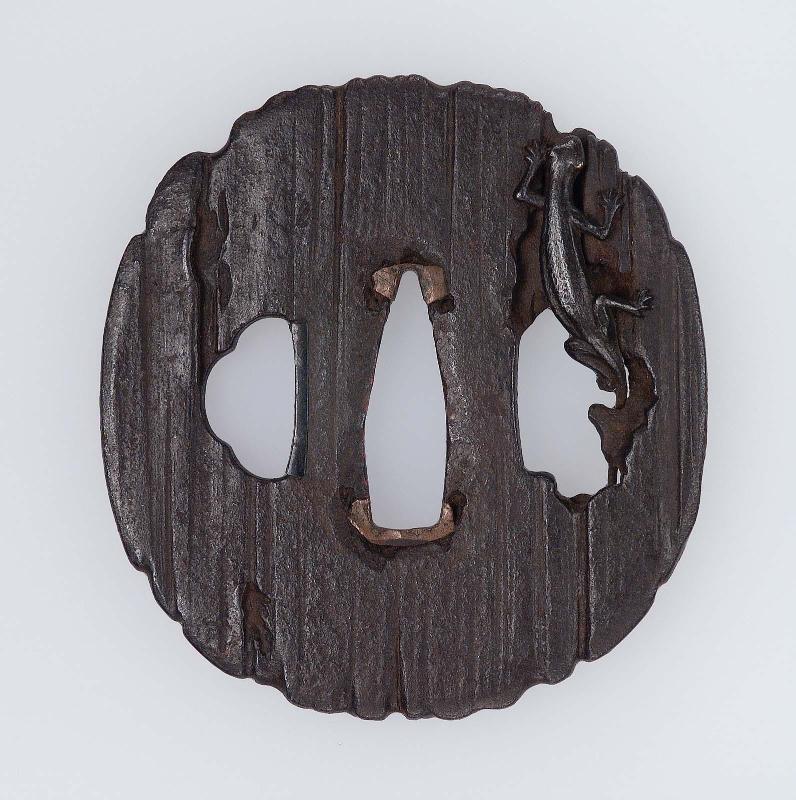 Tsuba with design of lizard and piece of rotten wood