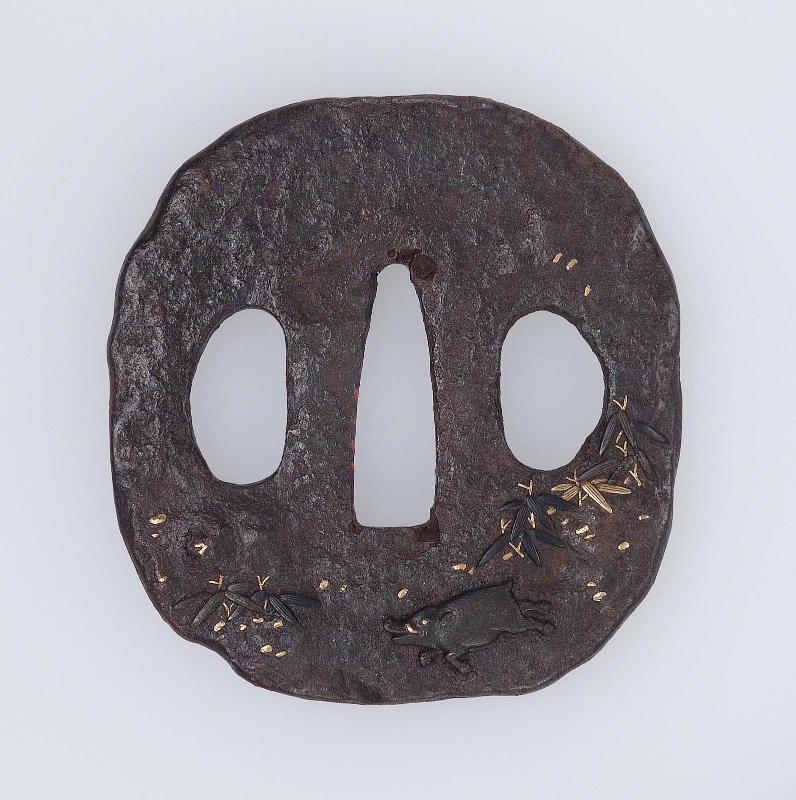 Tsuba with design of wild boar and bamboo grass