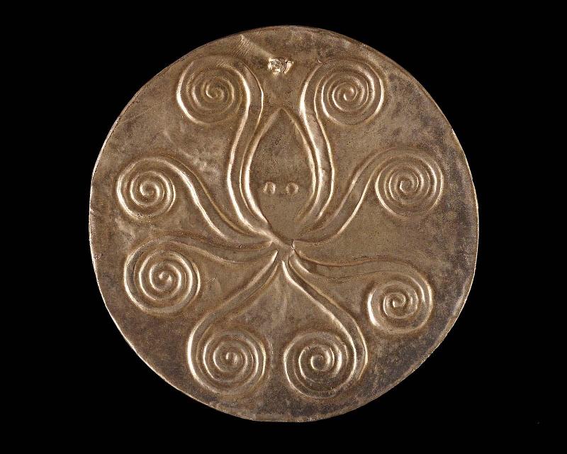 Reproduction of gold embossed disk with cuttlefish