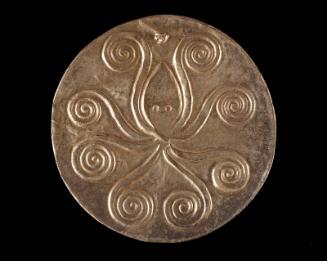 Reproduction of gold embossed disk with cuttlefish