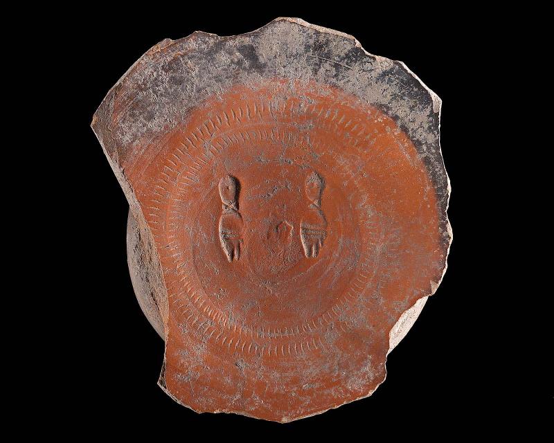 Bottom of a dish with two stamps