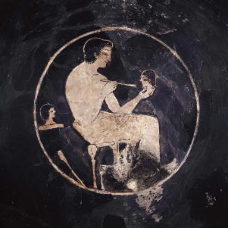 Drinking cup (kylix) with an artist painting a head