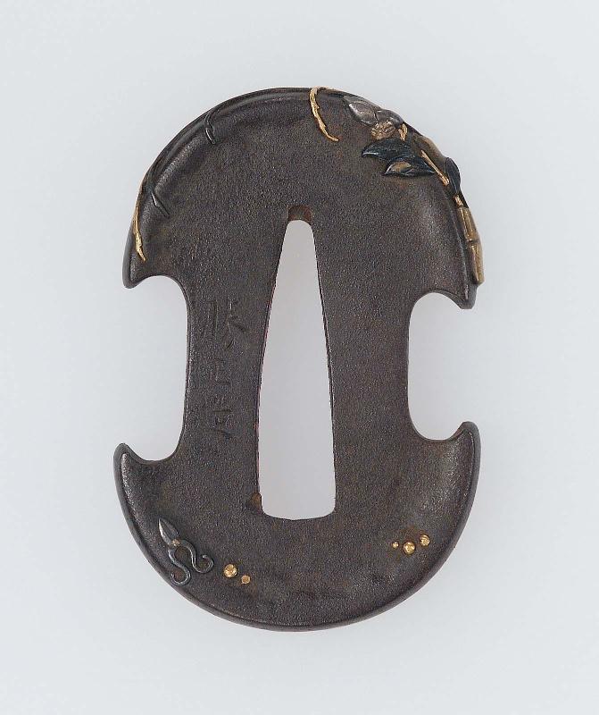 Tsuba with design of flower arrangement in a bamboo container