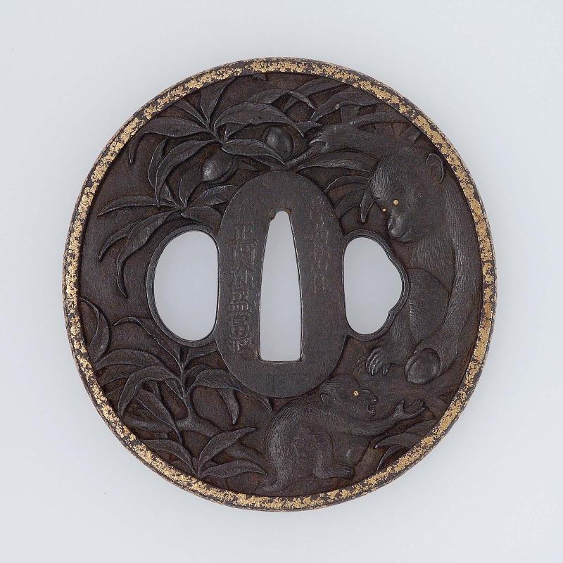 Tsuba with design of monkeys in a peach tree