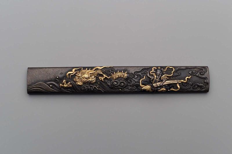 Kozuka with design of Benten taming a dragon by playing the koto