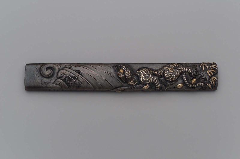 Kozuka with design of tiger climbing a pine tree